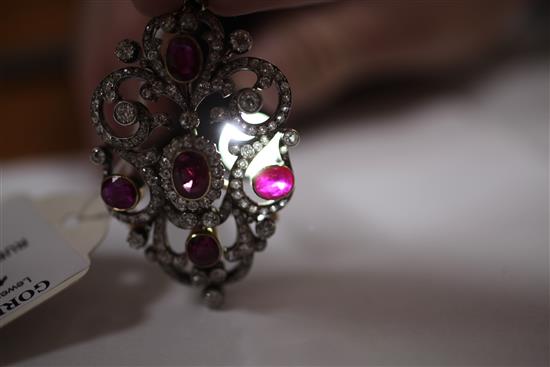 An attractive early 20th century gold and platinum, ruby and diamond pendant brooch, overall 2.5in.
